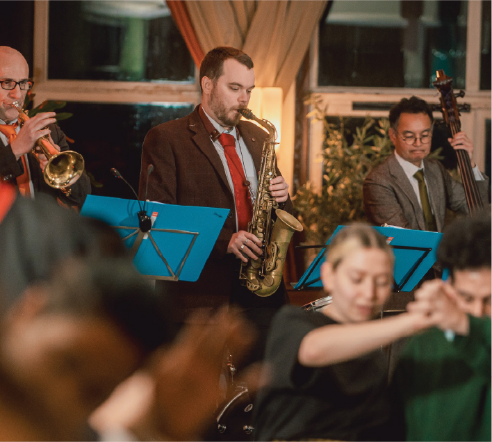 Jazzton playing saxophone in band
